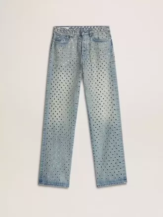 Jeans da donna lavati con occhielli su tutta la superficie