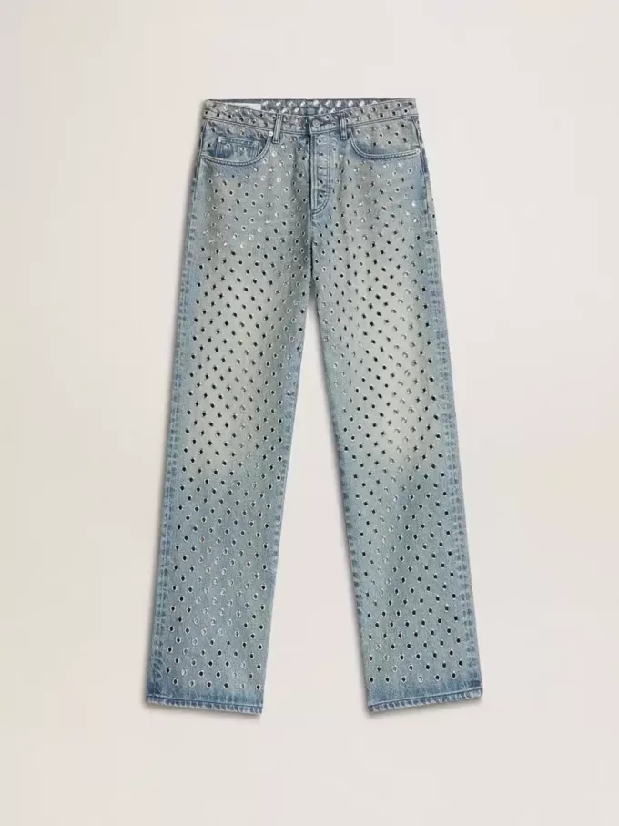Jeans da donna lavati con occhielli su tutta la superficie