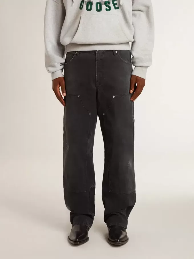 Jeans da uomo in cotone nero effetto consumato con toppe frontali