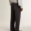 Jeans da uomo in cotone nero effetto consumato con toppe frontali