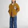 Jeans larghi da bambina con stampa e lavaggio medio Jeans larghi da bambina con stampa e lavaggio medio