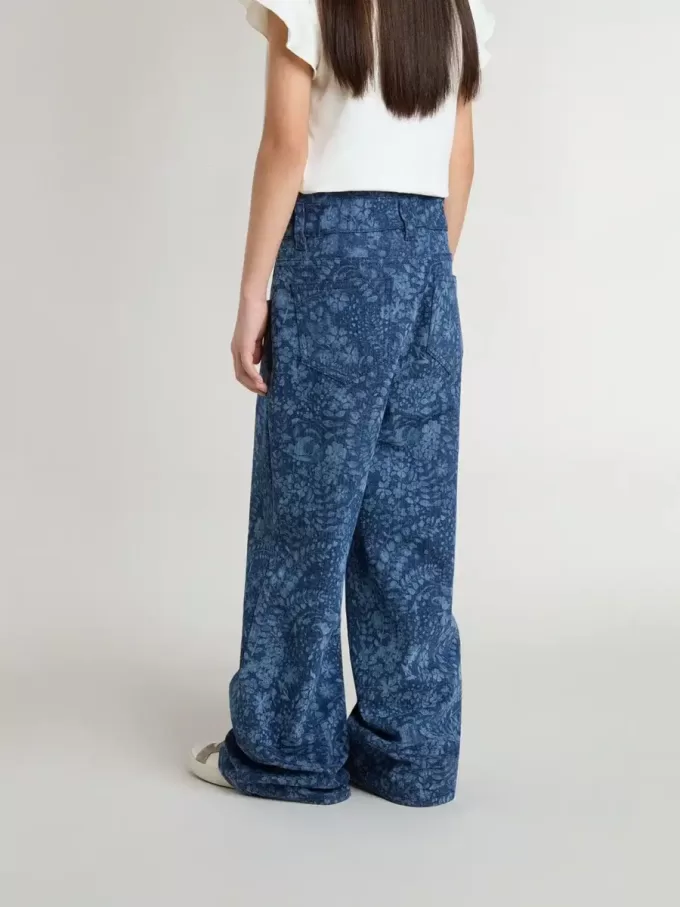 Jeans larghi da bambina con stampa e lavaggio medio Jeans larghi da bambina con stampa e lavaggio medio