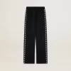 Joggers da donna neri con stelle bianche sui lati Joggers da donna neri con stelle bianche sui lati
