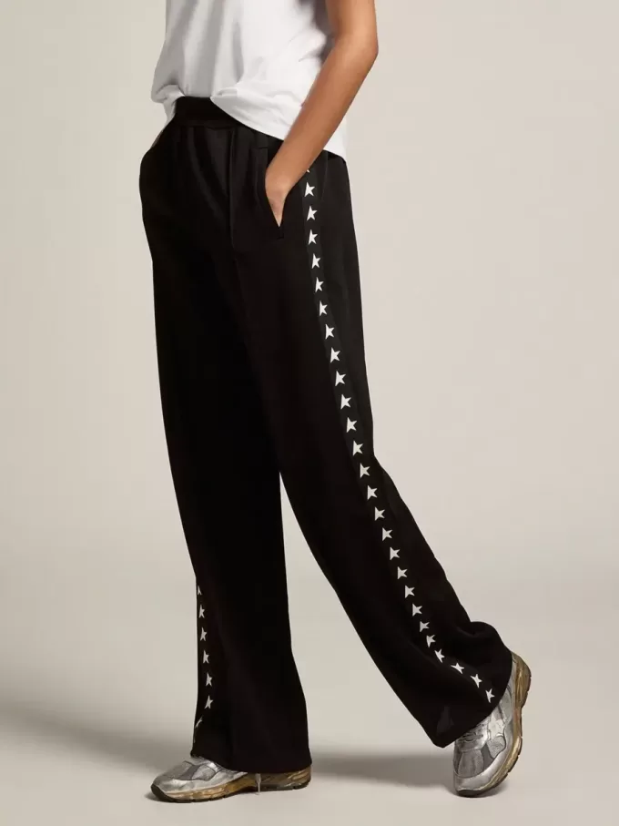 Joggers da donna neri con stelle bianche sui lati Joggers da donna neri con stelle bianche sui lati