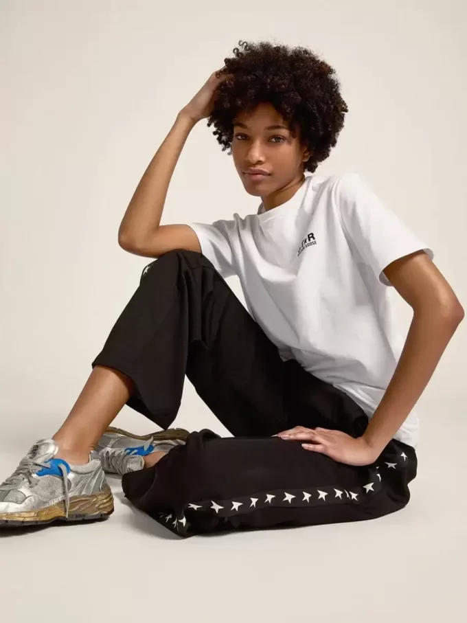 Joggers da donna neri con stelle bianche sui lati Joggers da donna neri con stelle bianche sui lati