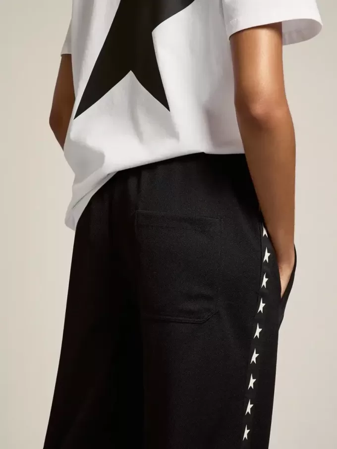 Joggers da donna neri con stelle bianche sui lati Joggers da donna neri con stelle bianche sui lati