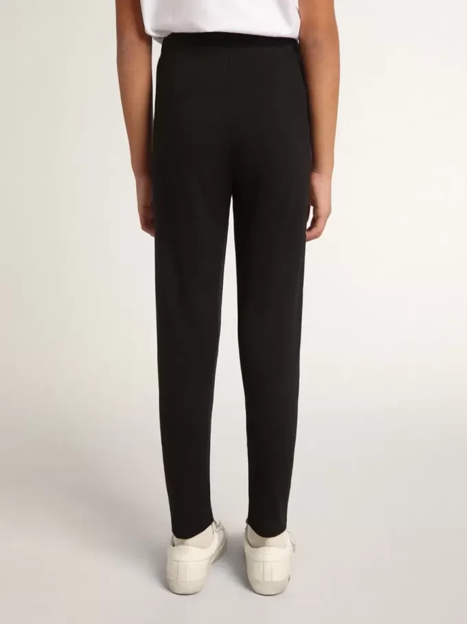 Leggings neri da bambina con stelle bianche sui lati Leggings neri da bambina con stelle bianche sui lati