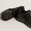 Lightstar da donna con tomaia in pelle nera e mesh e stella nera Lightstar da donna con tomaia in pelle nera e mesh e stella nera