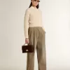 Maglione corto con scollo rotondo in lana beige con cristalli su tutta la superficie Maglione corto con scollo rotondo in lana beige con cristalli su tutta la superficie