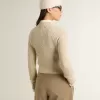 Maglione corto con scollo rotondo in lana beige con cristalli su tutta la superficie Maglione corto con scollo rotondo in lana beige con cristalli su tutta la superficie