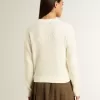 Maglione da donna con collo a giro in lana merino bianca con cristalli su tutta la superficie Maglione da donna con collo a giro in lana merino bianca con cristalli su tutta la superficie