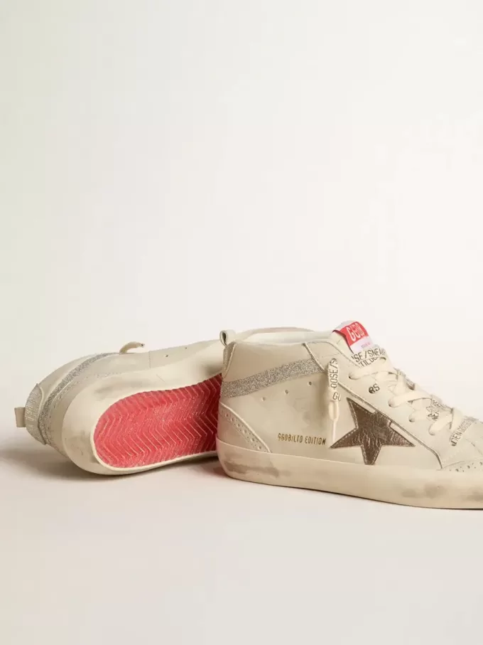 Mid Star LTD da donna con stella in pelle bronzo e flash in cristallo Swarovski Mid Star LTD da donna con stella in pelle bronzo e flash in cristallo Swarovski