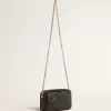 Mini Star Bag in pelle nera con stella tono su tono Mini Star Bag in pelle nera con stella tono su tono