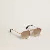 Occhiali da sole stile aviatore con montatura dorata e lenti beige Occhiali da sole stile aviatore con montatura dorata e lenti beige