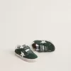 Old School Young in pelle scamosciata verde con stella e linguetta sul tallone in pelle bianca Old School Young in pelle scamosciata verde con stella e linguetta sul tallone in pelle bianca