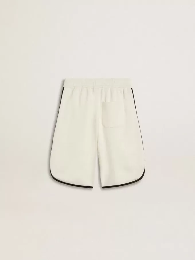 Pantaloncini bianchi da bambino con logo ricamato
