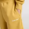 Pantaloncini da jogging per bambini in giallo ocra con ricamo