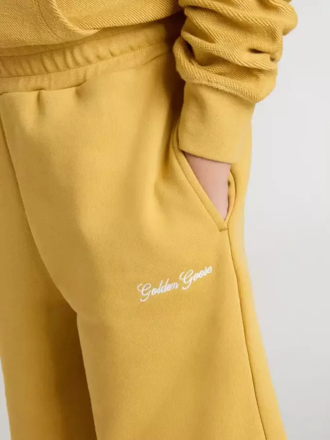 Pantaloncini da jogging per bambini in giallo ocra con ricamo