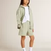 Pantaloncini verde chiaro con stella bianca Pantaloncini verde chiaro con stella bianca