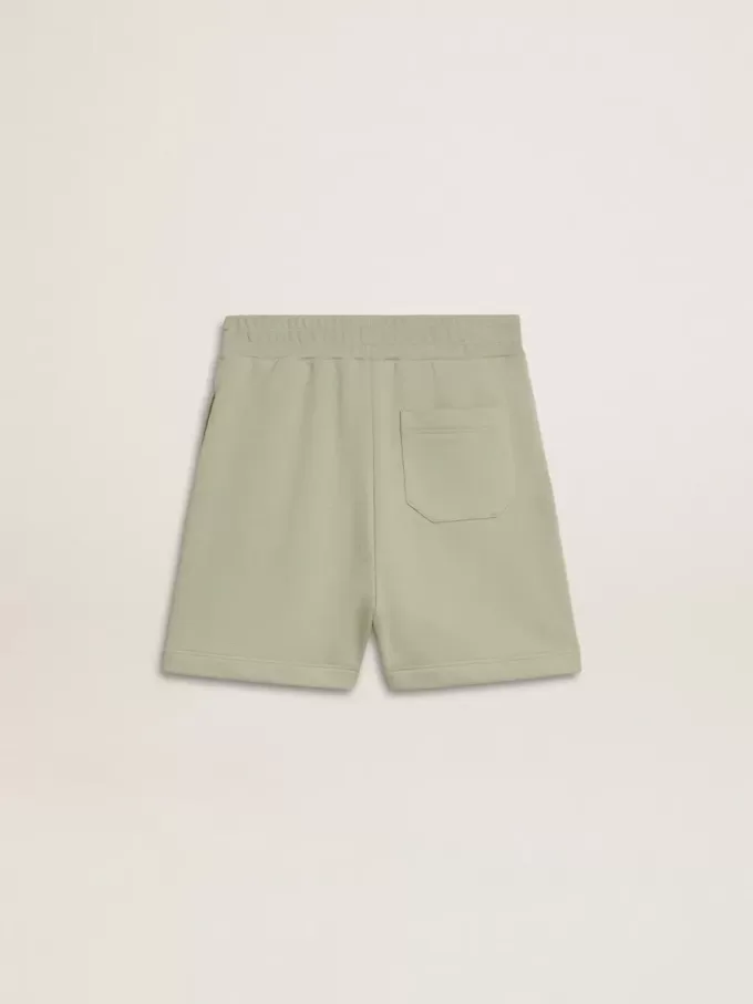 Pantaloncini verde chiaro con stella bianca Pantaloncini verde chiaro con stella bianca