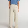 Pantaloni chino beige per bambino con spruzzi multicolori
