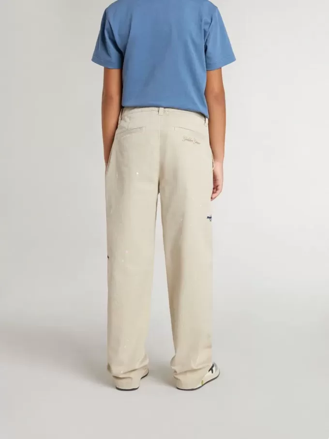 Pantaloni chino beige per bambino con spruzzi multicolori