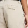 Pantaloni chino beige per bambino con spruzzi multicolori