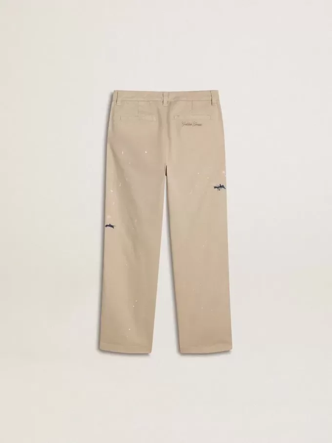 Pantaloni chino beige per bambino con spruzzi multicolori
