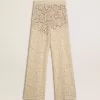 Pantaloni da donna color crema in pizzo trasparente Pantaloni da donna color crema in pizzo trasparente