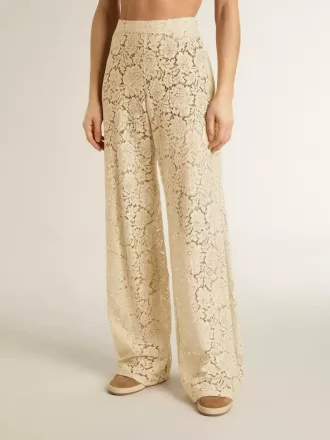 Pantaloni da donna color crema in pizzo trasparente