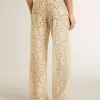 Pantaloni da donna color crema in pizzo trasparente Pantaloni da donna color crema in pizzo trasparente