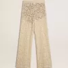 Pantaloni da donna color crema in pizzo trasparente Pantaloni da donna color crema in pizzo trasparente
