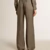 Pantaloni da donna in misto viscosa e seta verde con motivo floreale Pantaloni da donna in misto viscosa e seta verde con motivo floreale