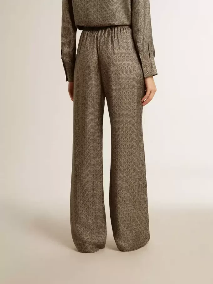 Pantaloni da donna in misto viscosa e seta verde con motivo floreale Pantaloni da donna in misto viscosa e seta verde con motivo floreale