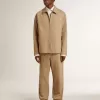 Pantaloni da uomo beige con toppe