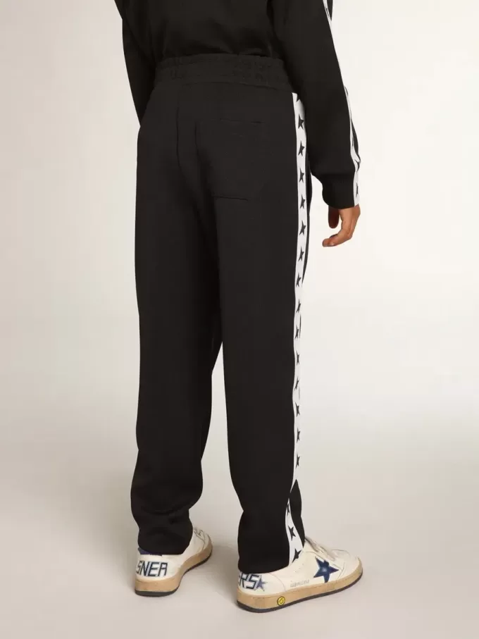 Pantaloni jogging blu scuro con striscia bianca e stelle a contrasto