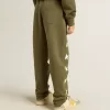 Pantaloni jogging da bambino verde militare con stelle bianche