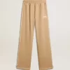Pantaloni jogging da donna beige chiaro con logo bianco Pantaloni jogging da donna beige chiaro con logo bianco