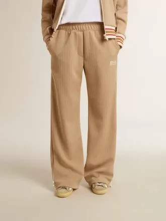 Pantaloni jogging da donna beige chiaro con logo bianco