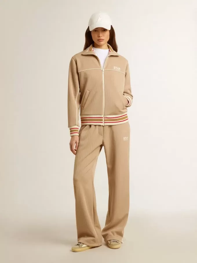 Pantaloni jogging da donna beige chiaro con logo bianco Pantaloni jogging da donna beige chiaro con logo bianco