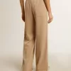 Pantaloni jogging da donna beige chiaro con logo bianco Pantaloni jogging da donna beige chiaro con logo bianco