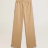 Pantaloni jogging da donna beige chiaro con logo bianco Pantaloni jogging da donna beige chiaro con logo bianco
