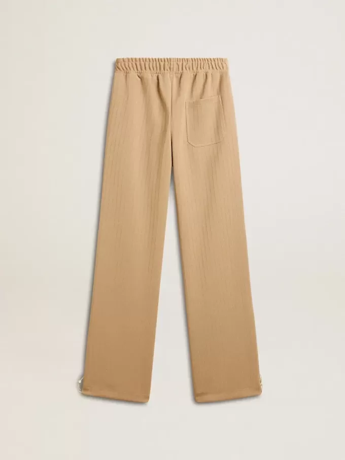 Pantaloni jogging da donna beige chiaro con logo bianco Pantaloni jogging da donna beige chiaro con logo bianco