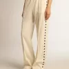 Pantaloni jogging da donna bianchi con stelle sui lati Pantaloni jogging da donna bianchi con stelle sui lati