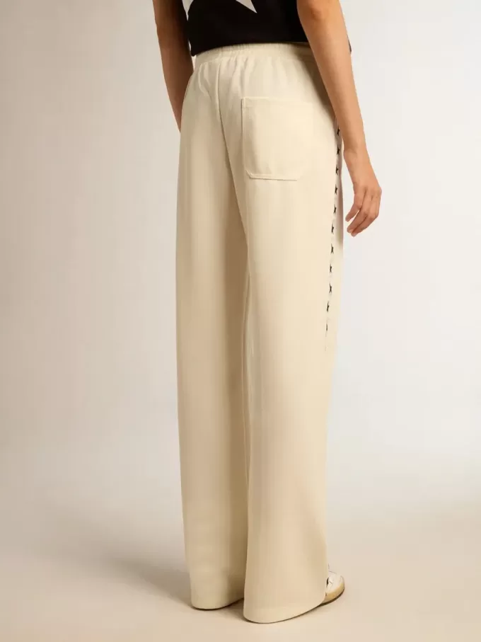 Pantaloni jogging da donna bianchi con stelle sui lati Pantaloni jogging da donna bianchi con stelle sui lati