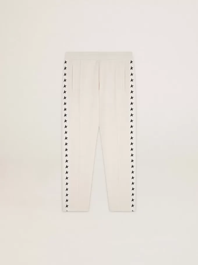 Pantaloni jogging da uomo bianchi con stelle nere sui lati Pantaloni jogging da uomo bianchi con stelle nere sui lati