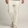 Pantaloni jogging da uomo bianchi con stelle nere sui lati Pantaloni jogging da uomo bianchi con stelle nere sui lati