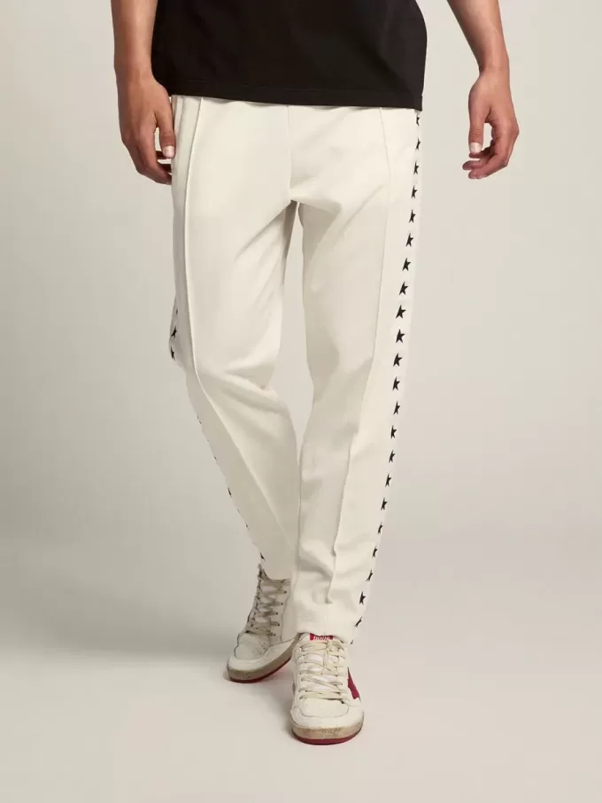 Pantaloni jogging da uomo bianchi con stelle nere sui lati Pantaloni jogging da uomo bianchi con stelle nere sui lati