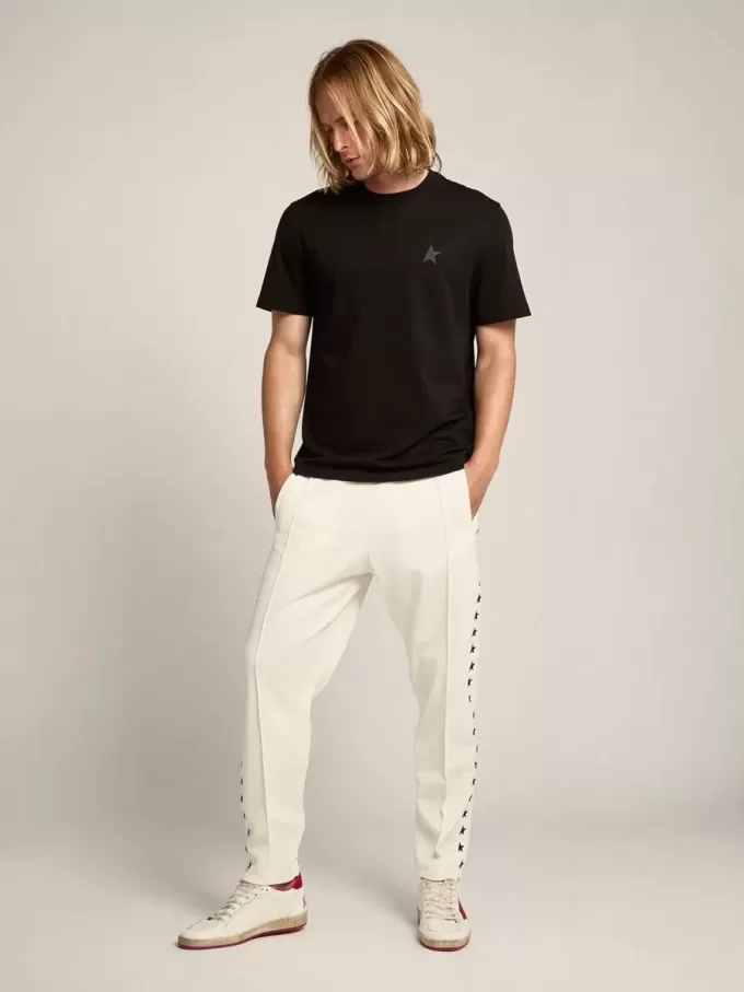 Pantaloni jogging da uomo bianchi con stelle nere sui lati Pantaloni jogging da uomo bianchi con stelle nere sui lati