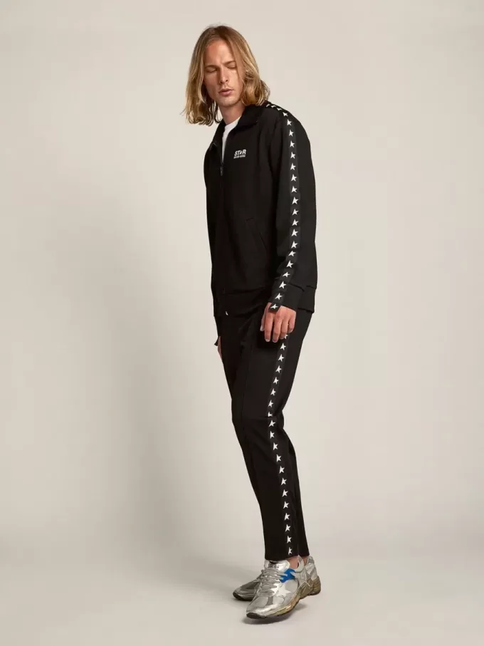 Pantaloni jogging da uomo neri con stelle bianche sui lati Pantaloni jogging da uomo neri con stelle bianche sui lati